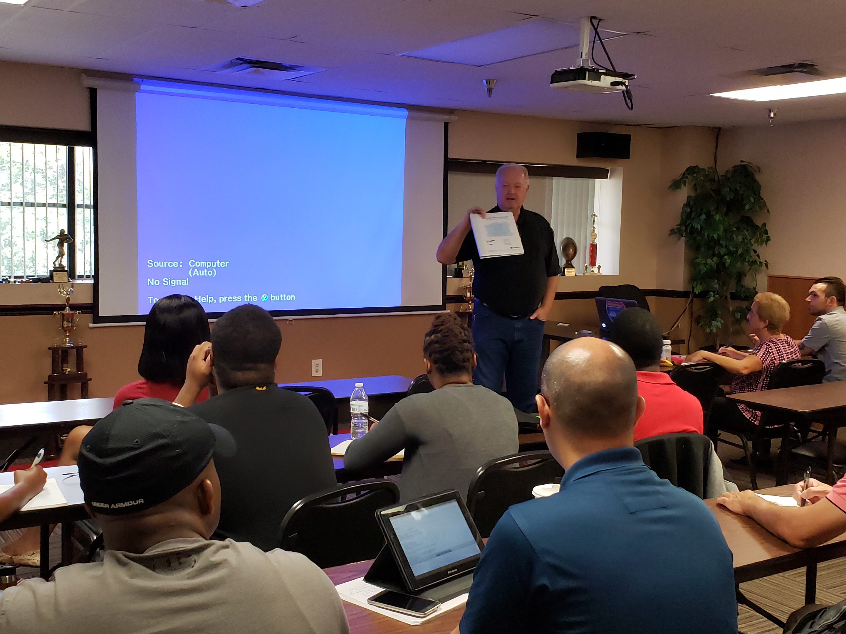 John teaching a class